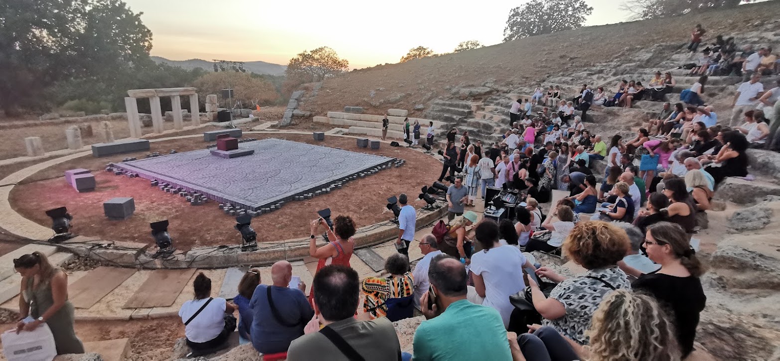 Audience attending a summer performance at the Ancient Theatre of Oiniades